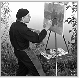 Stanley Roseman painting at his easel in the open air, France, 2014.