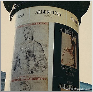At the entrance to the Albertina, Vienna, the column displaying the posters announcing the museum's exhibitions "Raphael in der Albertina" and "Stanley Roseman - Zeichnungen aus Kl�stern," 1983. � Photo by Ronald Davis